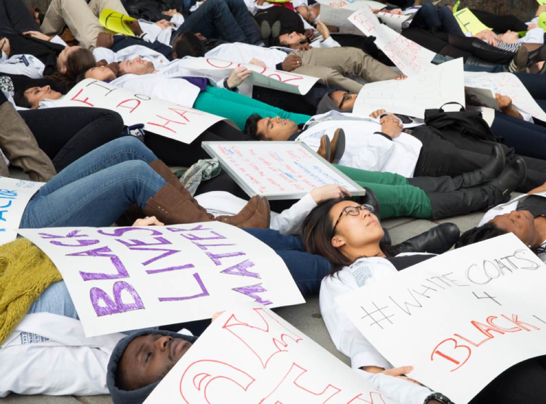students protesting for black lives matter by laying on the ground